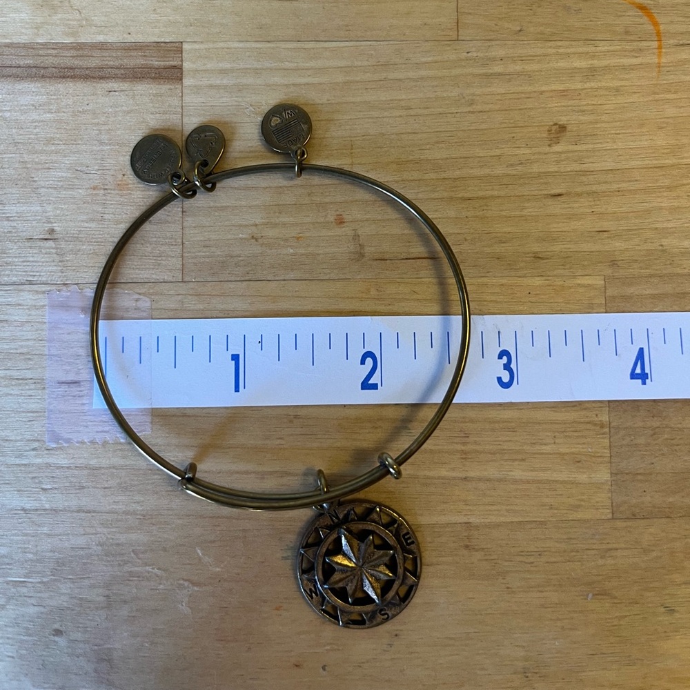 Elegant Gold Bangle with Compass Charm